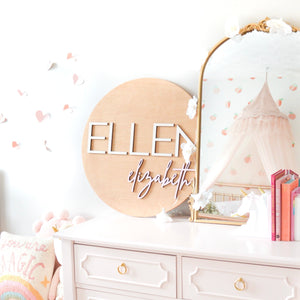Girls room blush pink decor with round name sign, gold mirror, pink dresser and whimsical  girly details